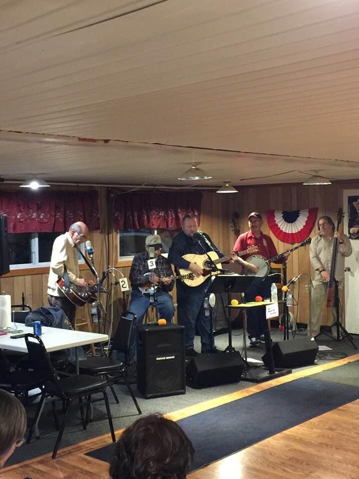 Mr. Stan Taylor playing Bluegrass at the coon hunters lodge . A lot of foot stompin’ !!!!