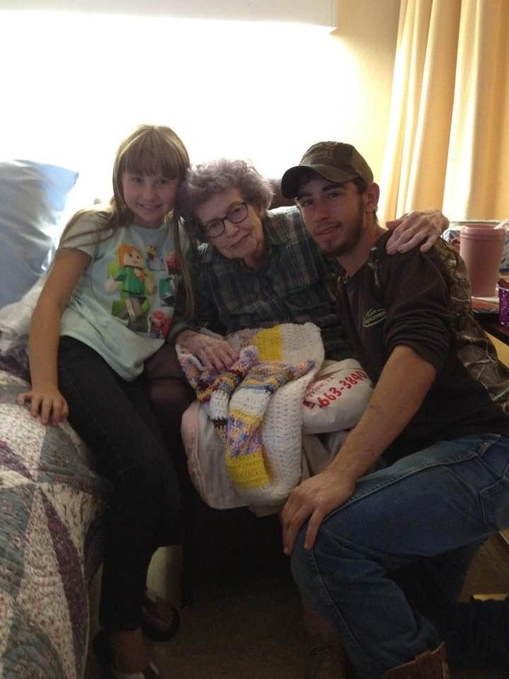 Marrion and Dalton with their great great aunt Gerry looking at her crocheted she is making for Marrion's doll. 97 years young.
