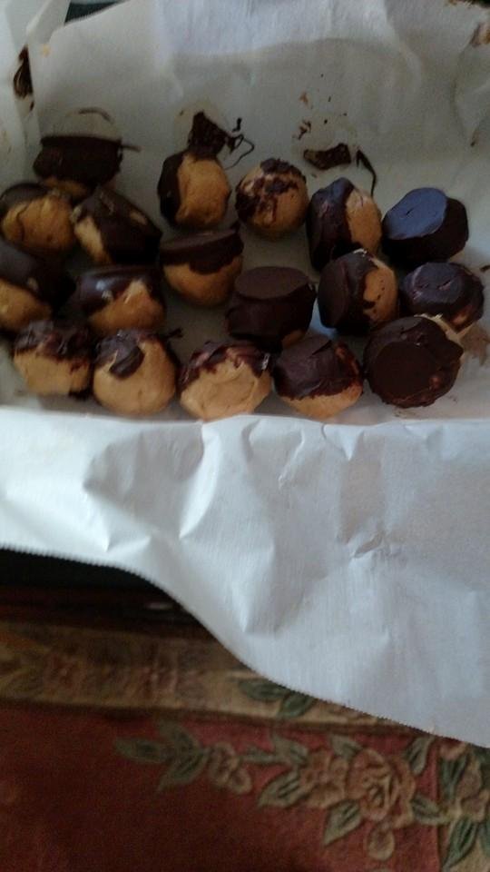 My first batch of buckeye balls. They are a little big and I ran out if chocolate but next batch will be perfect. By the way Charles and Kristine they are good and I will make you some