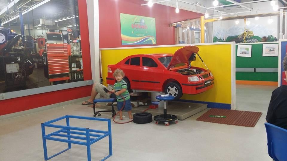 Mason helping Dad fix the car.