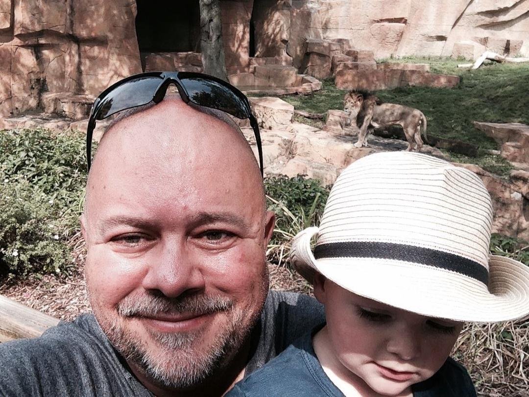 Papa and Tristan at the Lion exhibit