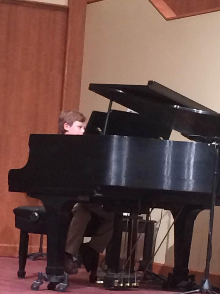My grandson Sam at the piano recital tonight. As always he nailed it. This dude has no fear. I'm so proud of him.