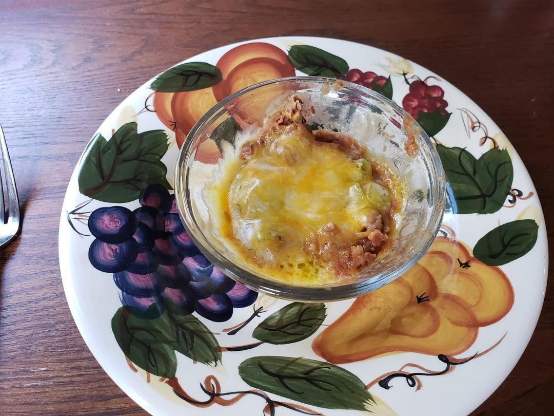 One of my mini meals! About 3 Tbsps of refried beans, with a pinch of diced green chilies and a pinch of cheddar cheese.