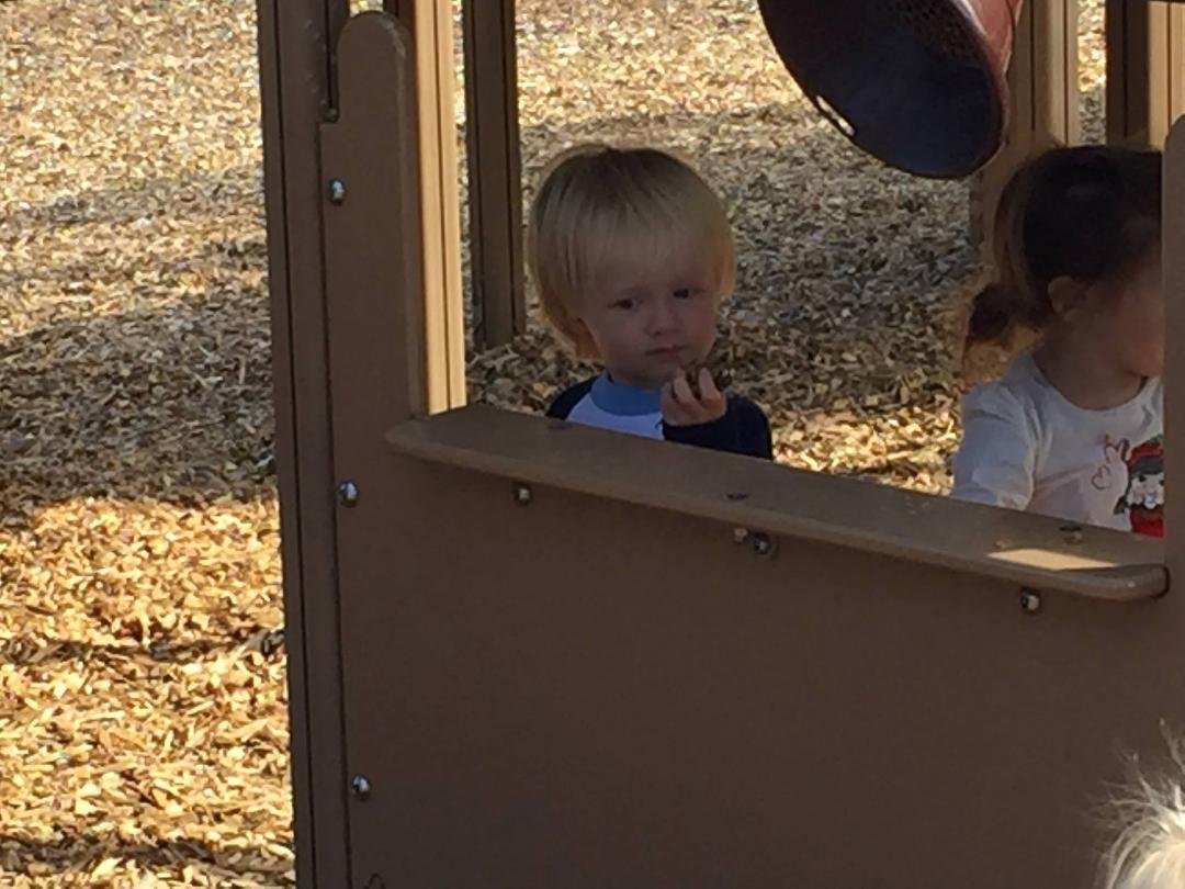 Bode playing snack bar at the park.