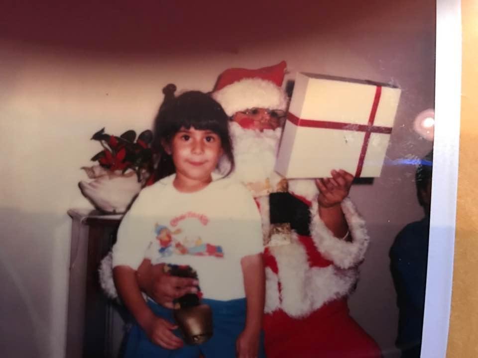 My niece Chrissy Kennedy. Me dressed up as Santa Claus. Chrissy there is a real Santa...I was just helping out.