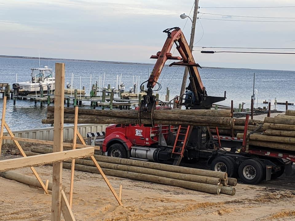 About 2 weeks ago they delivered the pilings. 20, 25 & 30 foot pressure treated southern yellow pine.