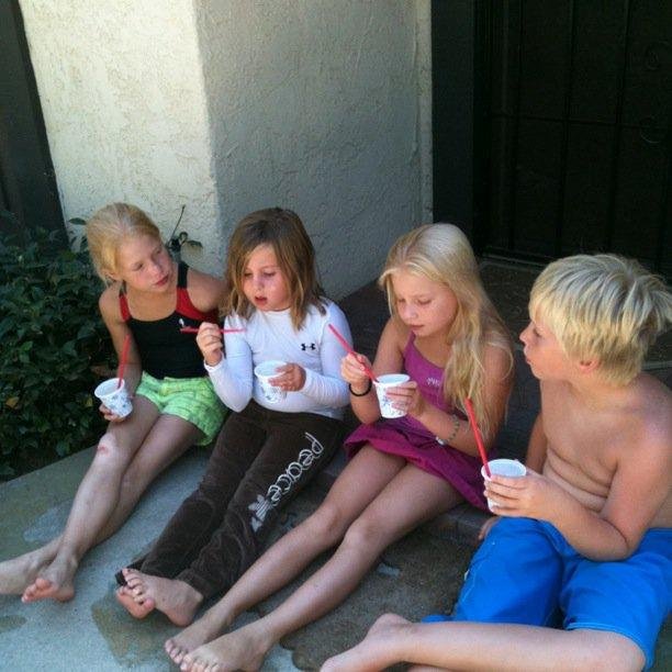 My charges for the day. L-R: Riley, Jerzie, Dakota and Ezra. So fun swimming, PB&J sandwiches, home made icees and scootering!