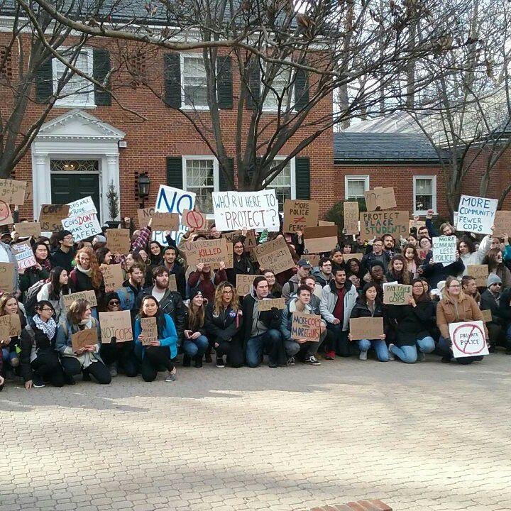 Johns Hopkins University students protest in front of the home of the University president. The students are protesting the plans for Hopkins to hire a private police Agency for the campus.