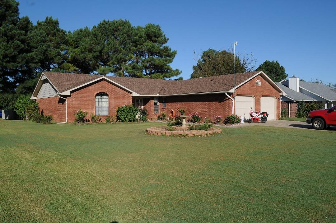 I finally got a decent camera to take a decent photo of our home here in Springdale. The trees behind the house are seven mature pines in the back yard.I love them but about three will have to go. I am contemplating incorpo
