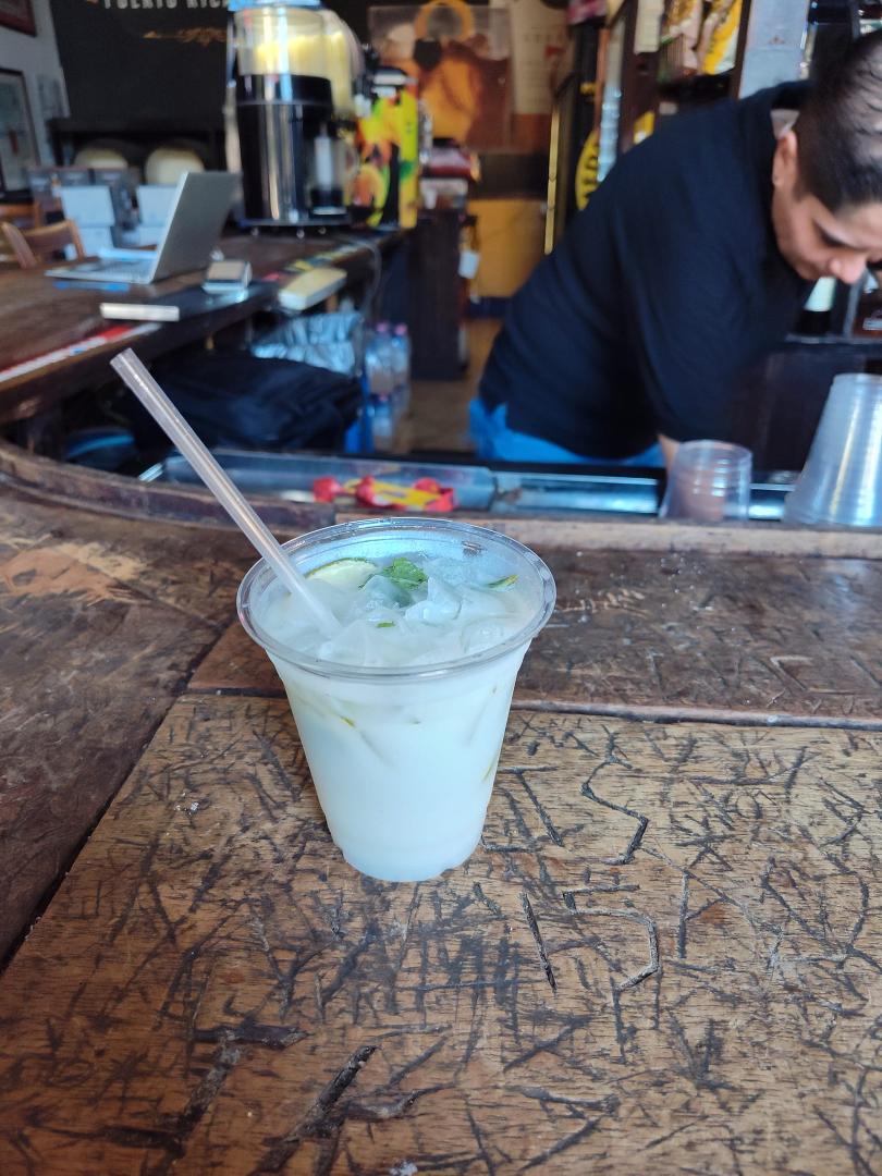 Having coconut drink. Life is good