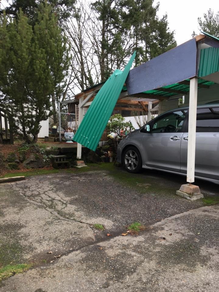 Carport roof blown off a home.