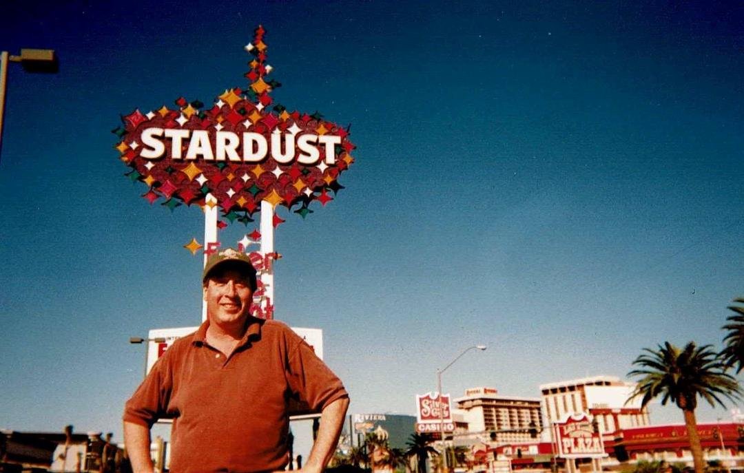Las Vegas 1990's - the Buellermesiter lovin the culture there & living and tasting the taste of this Great American entertainment complex -the background, historic sign of the now defunct Stardust Casino-Hotel from the Veg