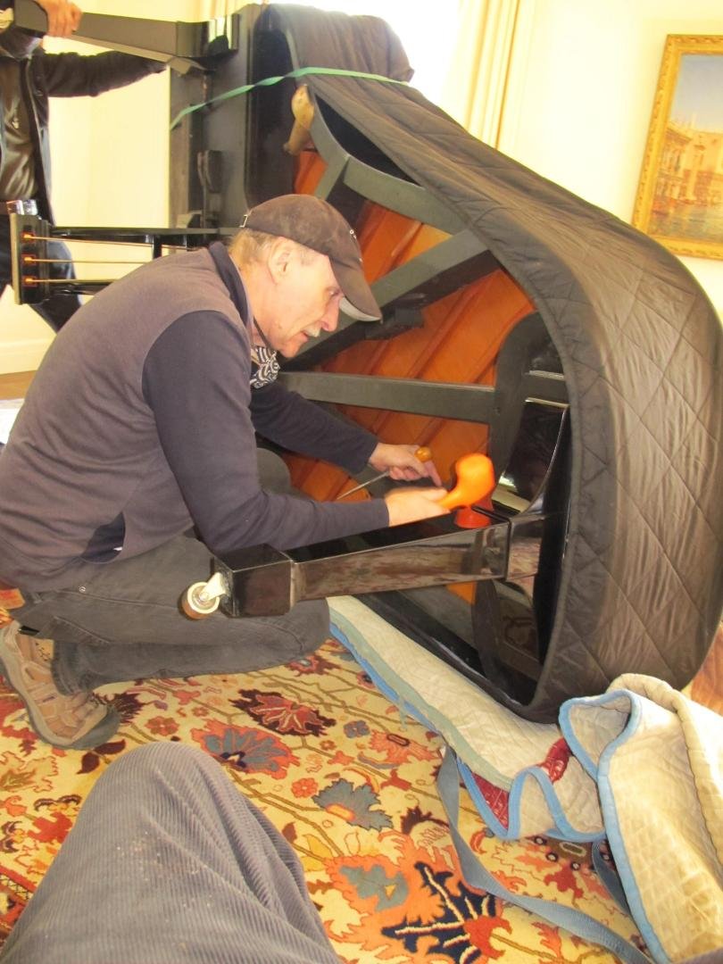 Mark Repetti, president of Beethoven Pianos, unpacking my Steinway B. Note the protective padding, cut to size, protecting the finish during transit. He personally supervises every delivery to make sure each instrument ar