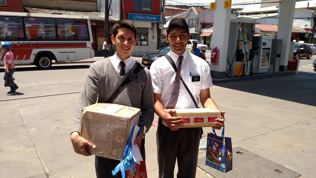 Delivering Christmas packages in Lota. Missionaries love packages.