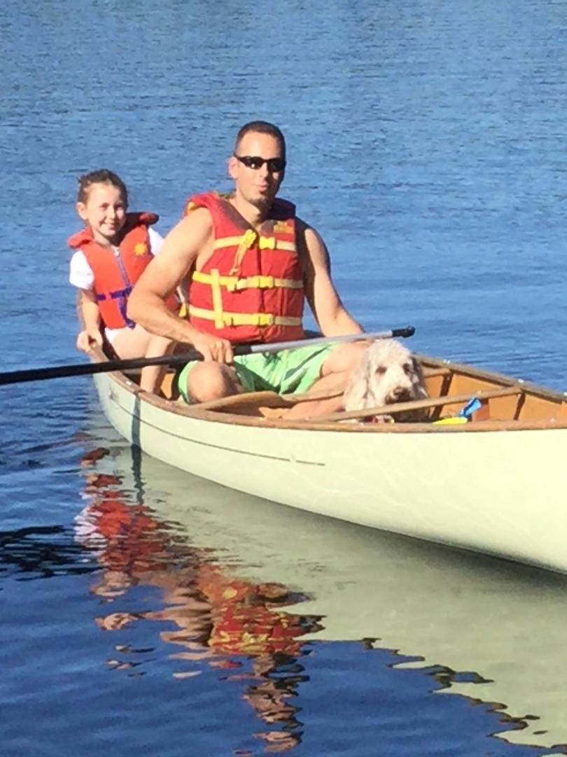 My dogs first canoe ride with my son and granddaughter
