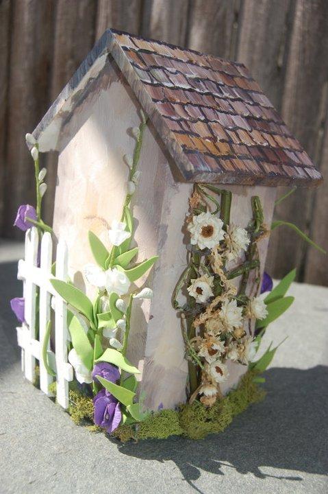 Side of the house with a rose arbor.