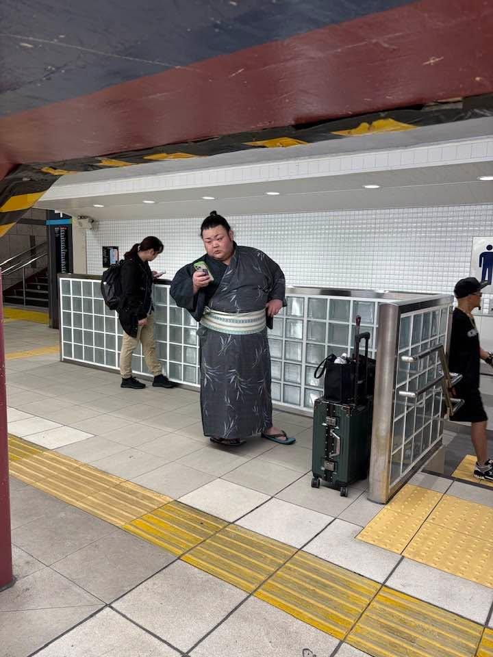 Sumo wrestler waiting for the subway in Tokyo.