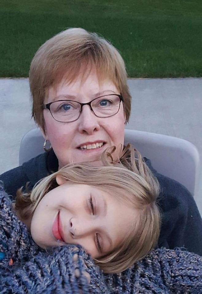 Snuggling at a campfire with eldest granddaughter Frannie.