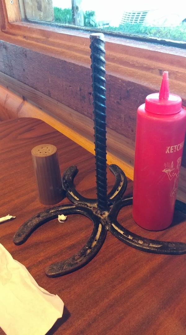 Charles Bidondo we ate dinner at a local BBQ joint and they had this paper towel holder made from 3 horseshoes and a piece of rebar. They set the condiments inside the horseshoes ... Great project idea ... And the BBQ was