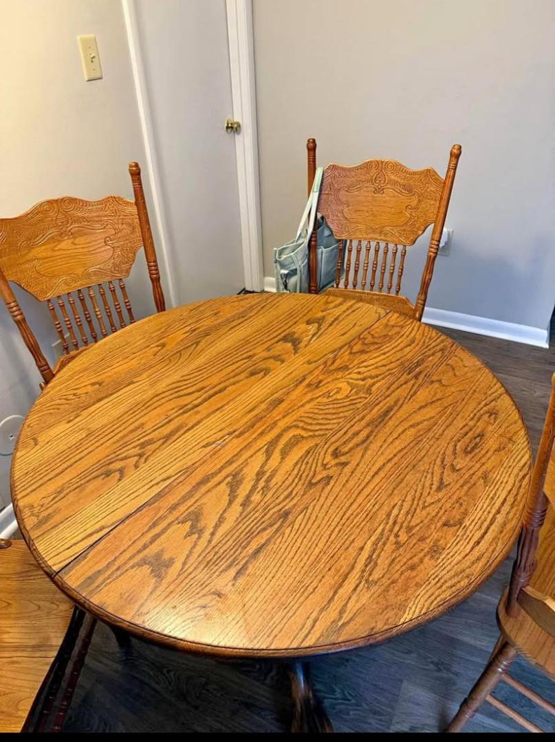 Wood pedestal table and 3 chairs. $100. 334-790-3260. Northside Dothan.