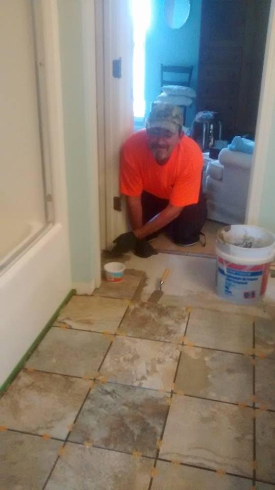 My sweet son-in-law putting tile in our guest bathroom. David and Bobby worked all weekend on half bath and this bathroom. Never dreamed it took so much work. It is beautiful!
