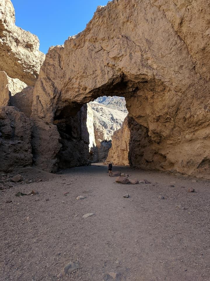 Irma standing under the Natural Bridge in Death Valley