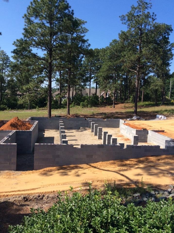 Foundation is finished. Smelly red clay/sand/dirt in place. Dumpster arrived this morning. Framing to begin soon. Quiet this morning, however 😊