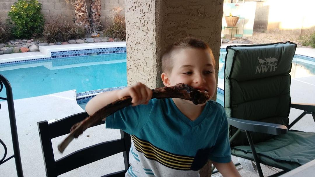 Happy Birthday to Grandson Ryder, devouring the tomahawk ribeye!