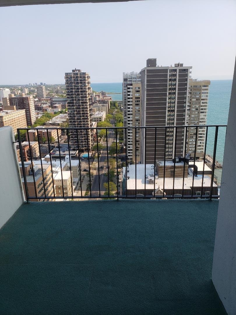 I took this out the bedroom window. You can see the balcony and the street. It was 52 degrees and windy so I didn't want to open the sliding door!! hahaha