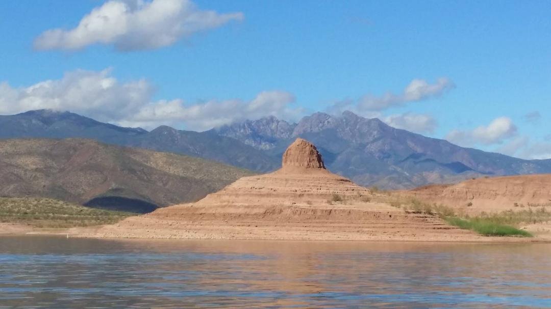 Nipple Rock with the Four Peaks in the background on Roosevelt Lake.