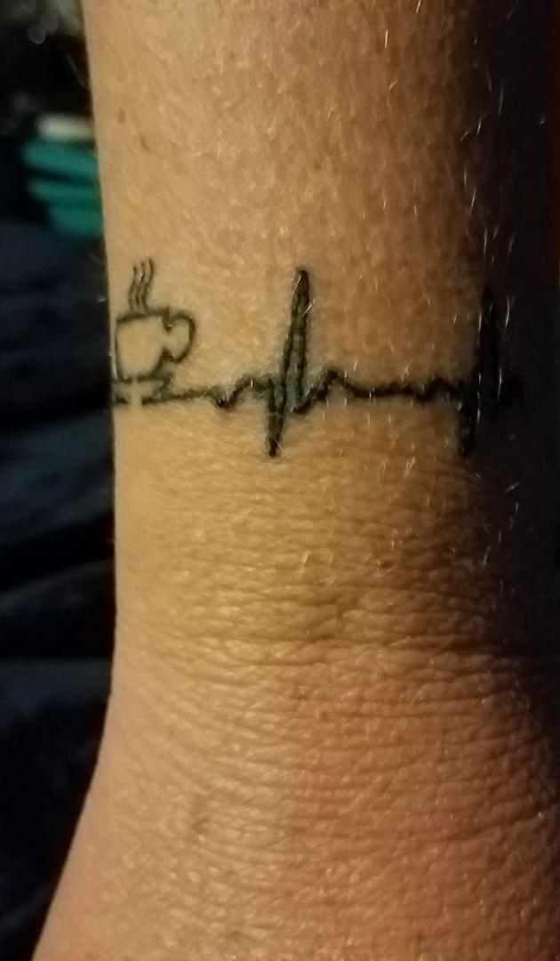 My newest tattoo, coffee is my life beat. Lol.