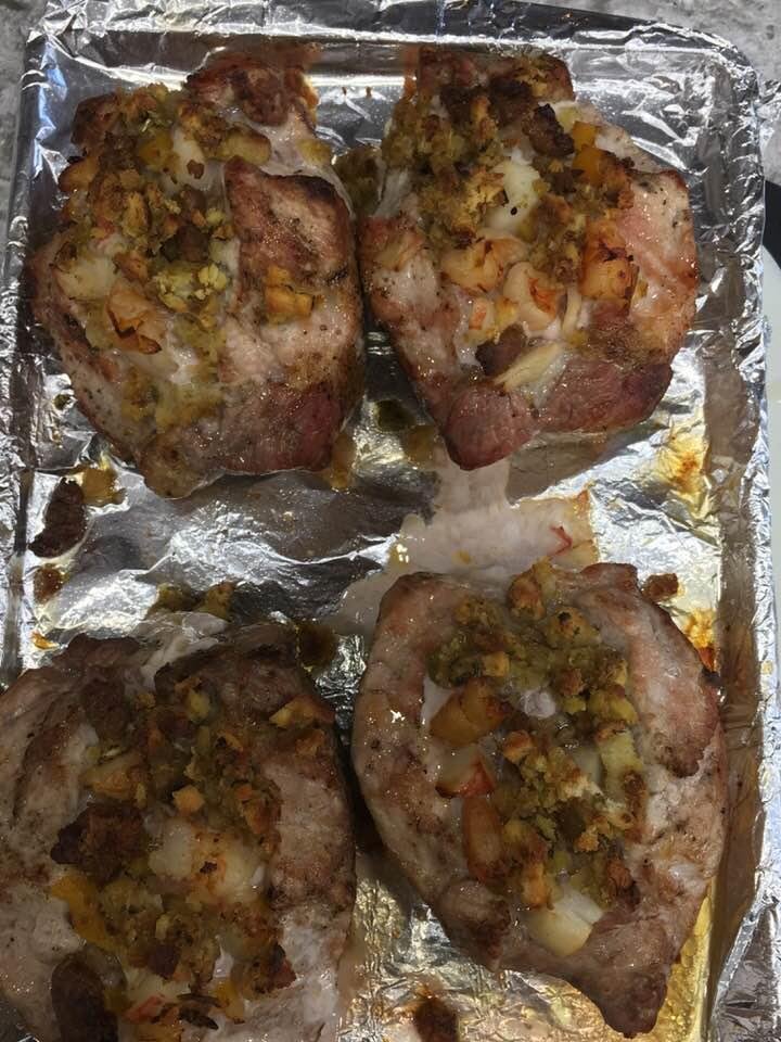 Doing something different for thanksgiving - stuffed pork chops with mild Italian sausage , crab, and shrimp. Glass of Pinot Noir with some sautéed veggies - good eats !!! 👍🏈😃