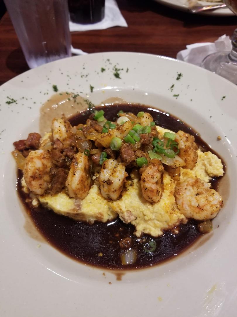 Andouille shrimp on cheese grits with burgundy sauce for lunch