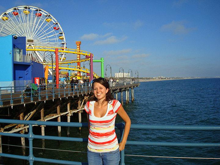 My daughter Adri at the Santa Monica pier, doing her best to smile for a picture even though she's completely blinded by the sun lol.