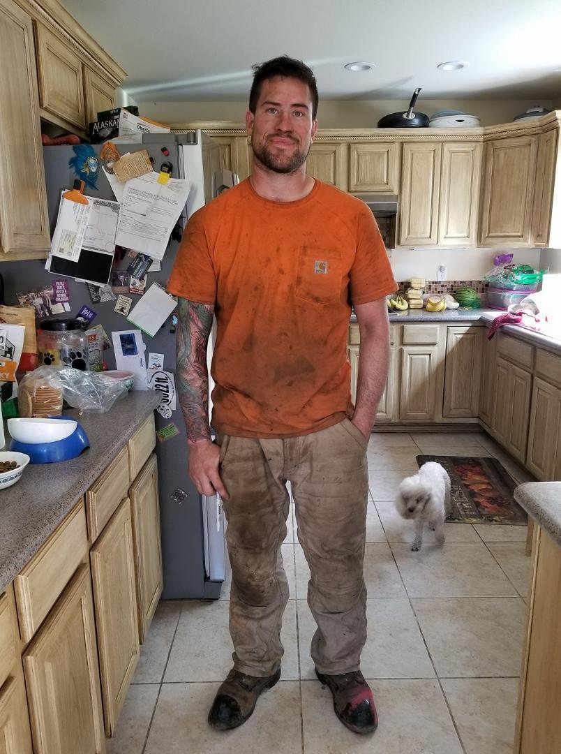 here's a guy who just got off work. poodles is so happy he's home.