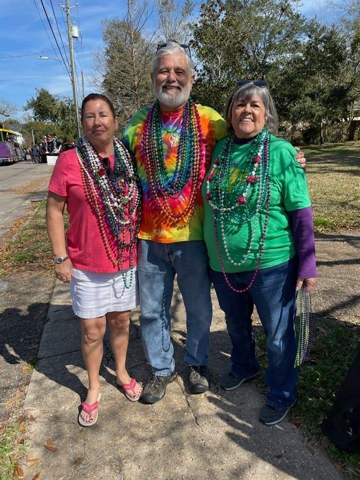 Mardi Gras Pass Christian style. We gave away more beads than we kept. Donna Mansfield, Max and me in front of my Aunt Evelyn's house. Parade passes right there!