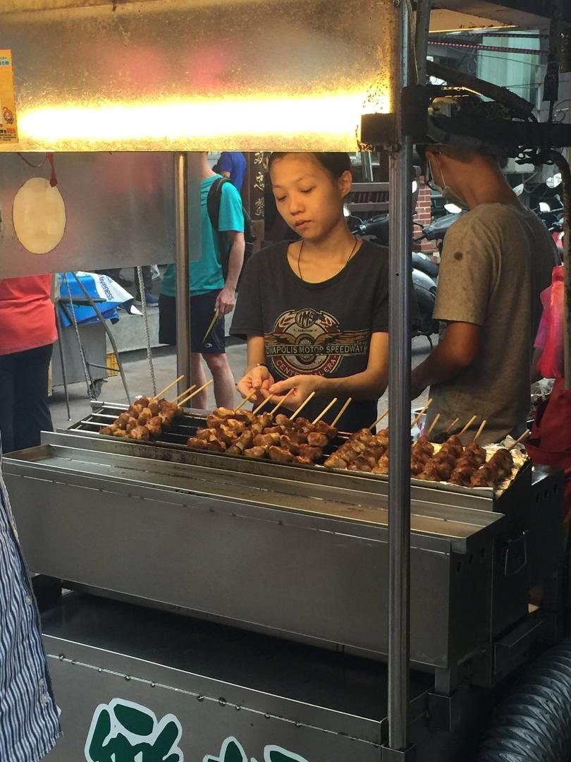 Next to the Stinky fofu vendor which Mary didn't even want to try becuase of the smell, there was a vendor that was selling BBQ Chicken on a stick. Turns out the woman running it spoke a little English and she pointed to a