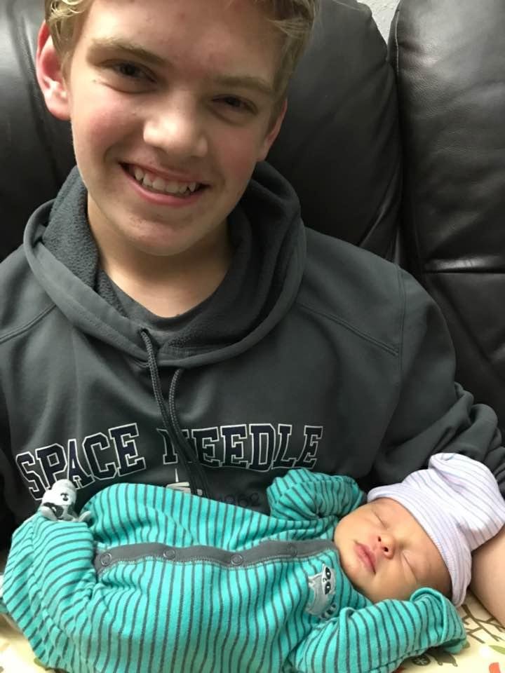Our grandson Britton holding his cousin Dylan.