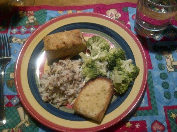 Tonight's birthday dinner: baked Parmesan crusted halibut, wild rice and steamed broccoli, garlic bread and little black dress Chardonnay