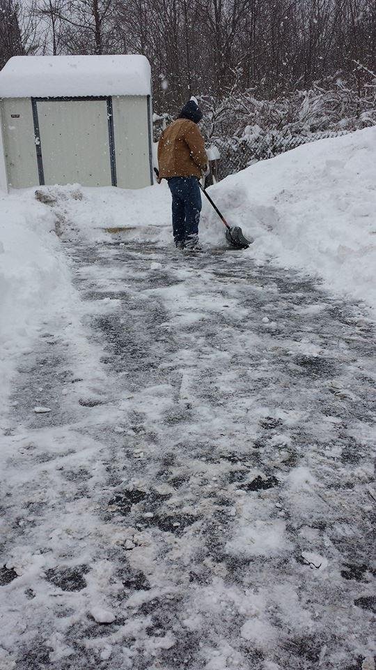 Justin shoveling a spot for the truck the park thank you