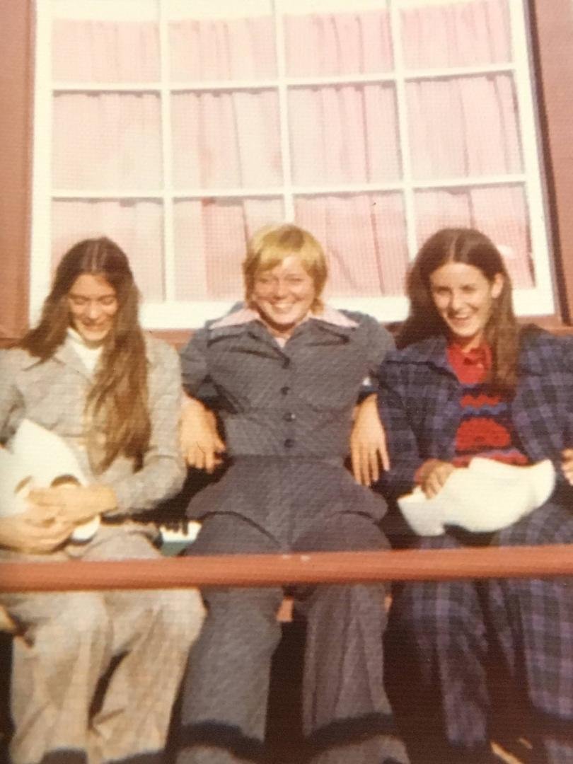 TBT.  1973 Holland MI.   High school seniors Anne Rentfrow and Nancy Clair Otterstrom visit Cindy Clair at Hope College. These clowns wear these wooden shoes from Holland to downtown Chicago on a Greyhound bus, causing many