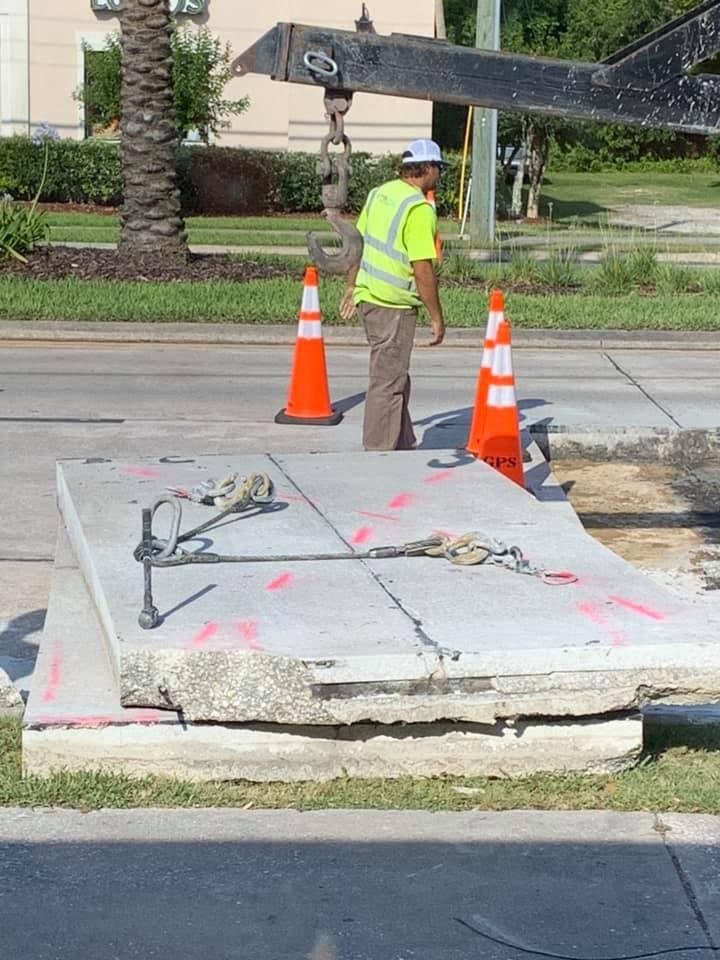 Your Federal Tax dollars at work. Removing perfectly fine sections of concrete to replace with new concrete. This is right in front of my office.