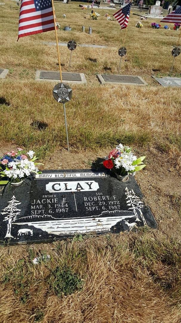 Fresh flowers and memories at the cemetery. Others supplied the flags and medallions