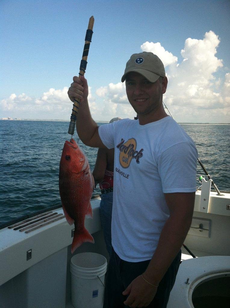 Patrick with a Red Snapper.

It was his lucky day - out of season.  Still swimming in the Gulf of Mexico.
