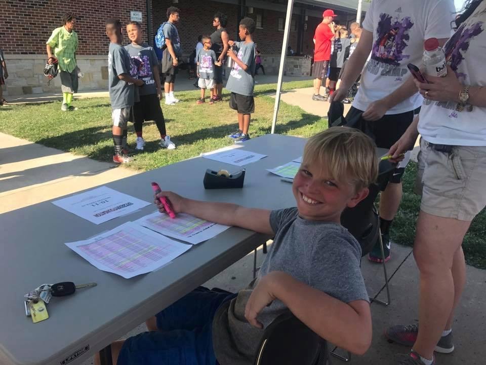 My grandson, Grayson Furjanic, manning the registration table at the Eric Berry Legend Camp in North KC today.
