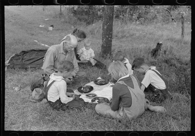 White Privilege
Muskogee County, Fort Gibson, Oklahoma — June 1939
The dust bowl during the 1930s had such bad dust storms, it would literally block out the sun. In this photo, a family prays while eating food during thei