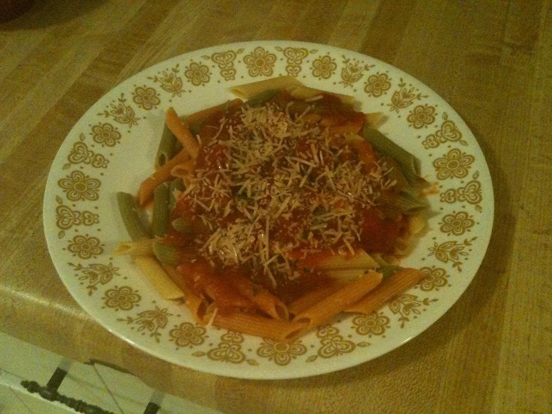Dinner (tomato, carrot, & spinach noodles w/ Vidalia onion with garlic sauce with added garlic & onion, and basil, garlic, & oregano diced tomatoes - topped with Parmesan and parsley)