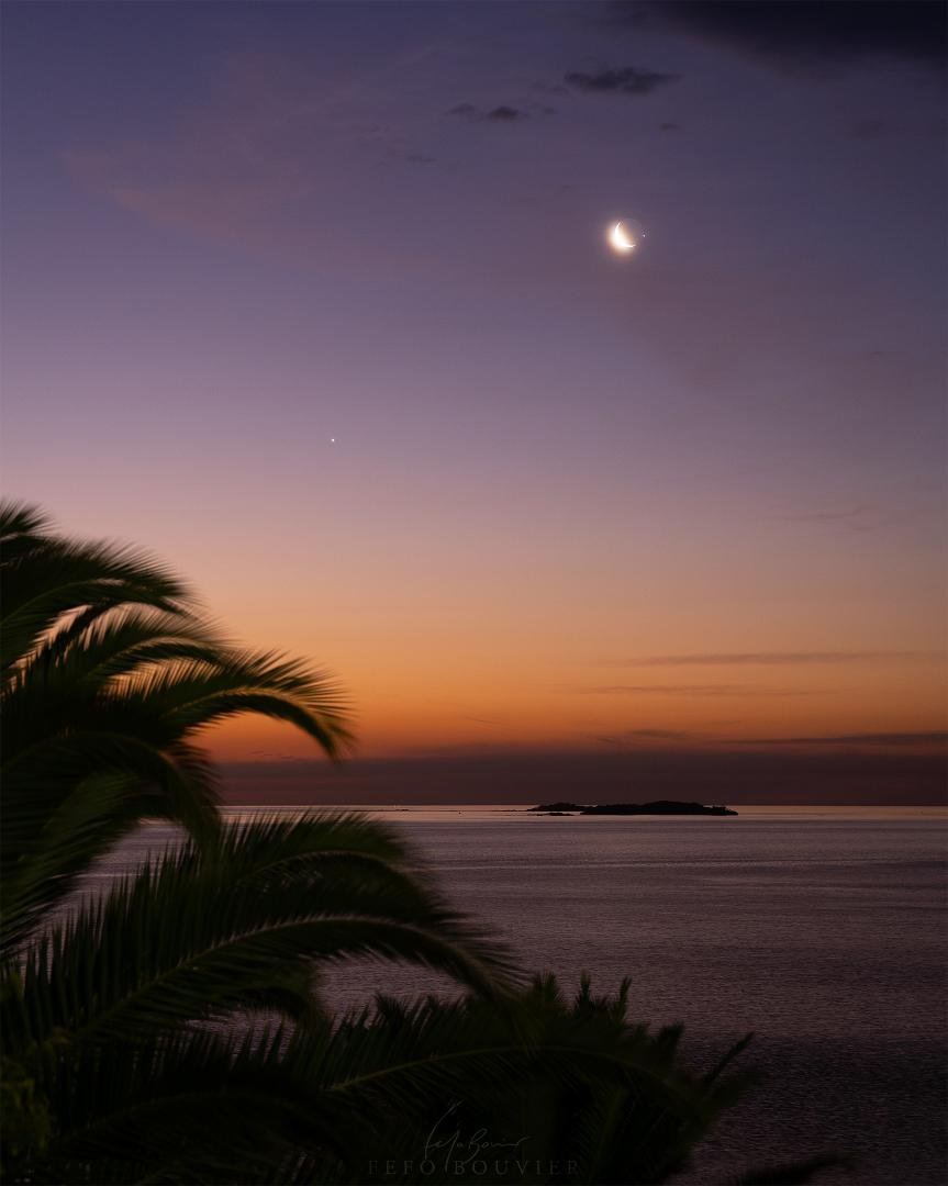 Crescent Moon Occultation
Image Credit & Copyright: Fefo Bouvier
Explanation: On February 22, a young Moon shared the western sky at sunset with bright planets Venus and Jupiter along the ecliptic plane. The beautiful cele