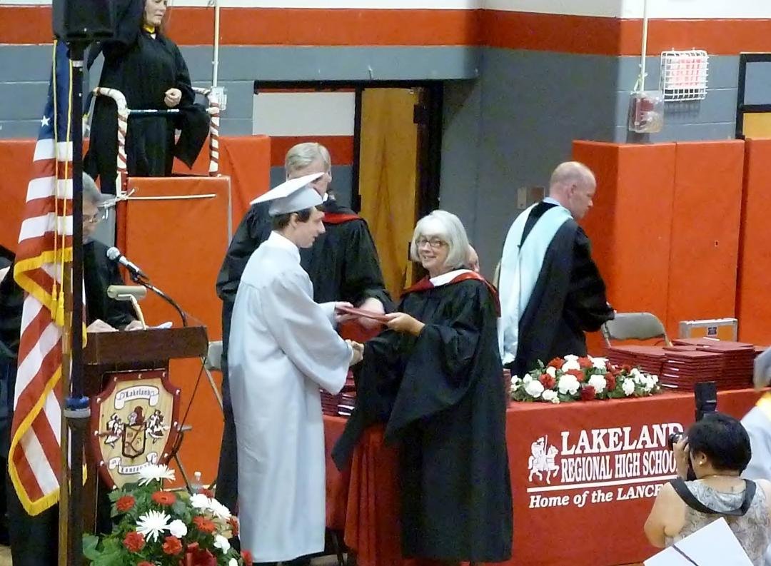 Justin accepting his diploma
