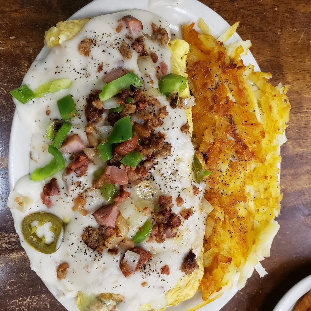 If you've never eaten at Waffles Cafe, you really need to. Great food and wonderful service. We went to Meadowbrook this morning. I had the ultimate omelet and Sandy had the country fried steak. We both brought half our ord